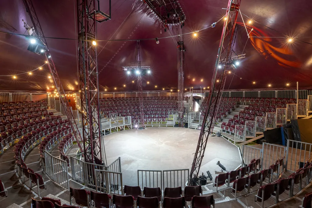 Inside Big Puck: maroon canvas, lights and the grandstand