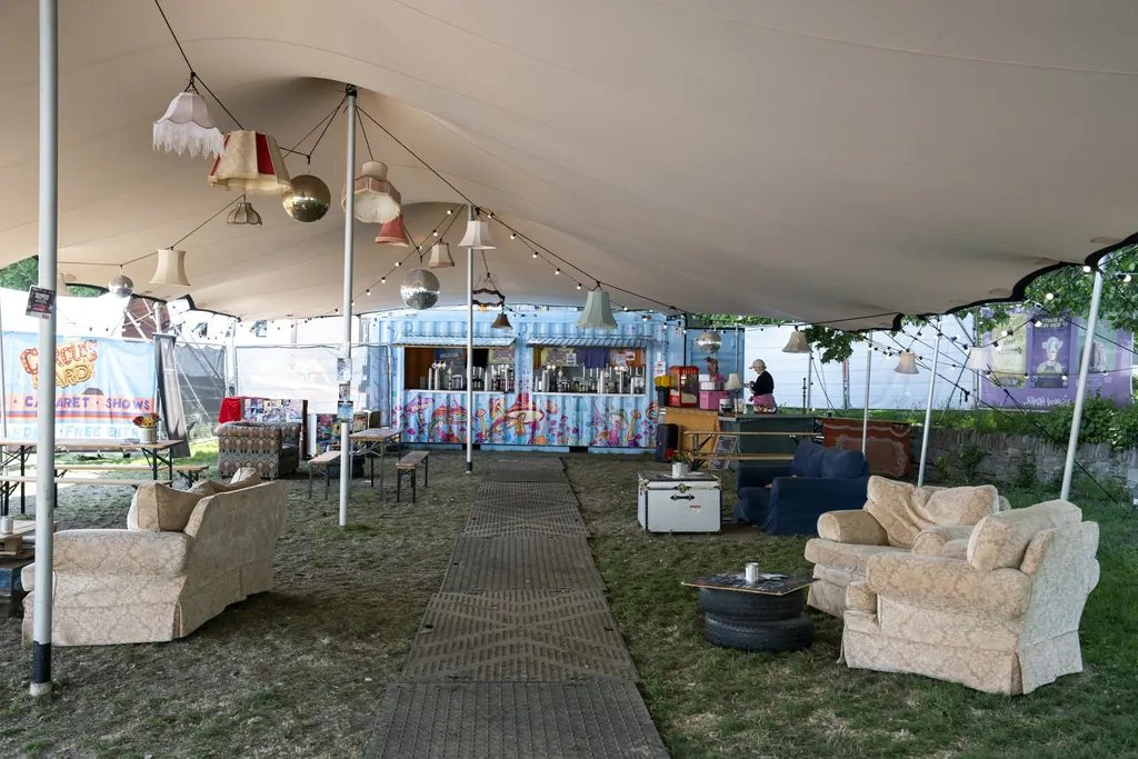 Our stretch tent set up as a lounge bar with sofas and festoon lights