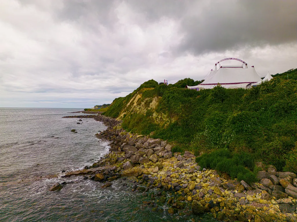 Big Puck pitched on a clifftop by the sea