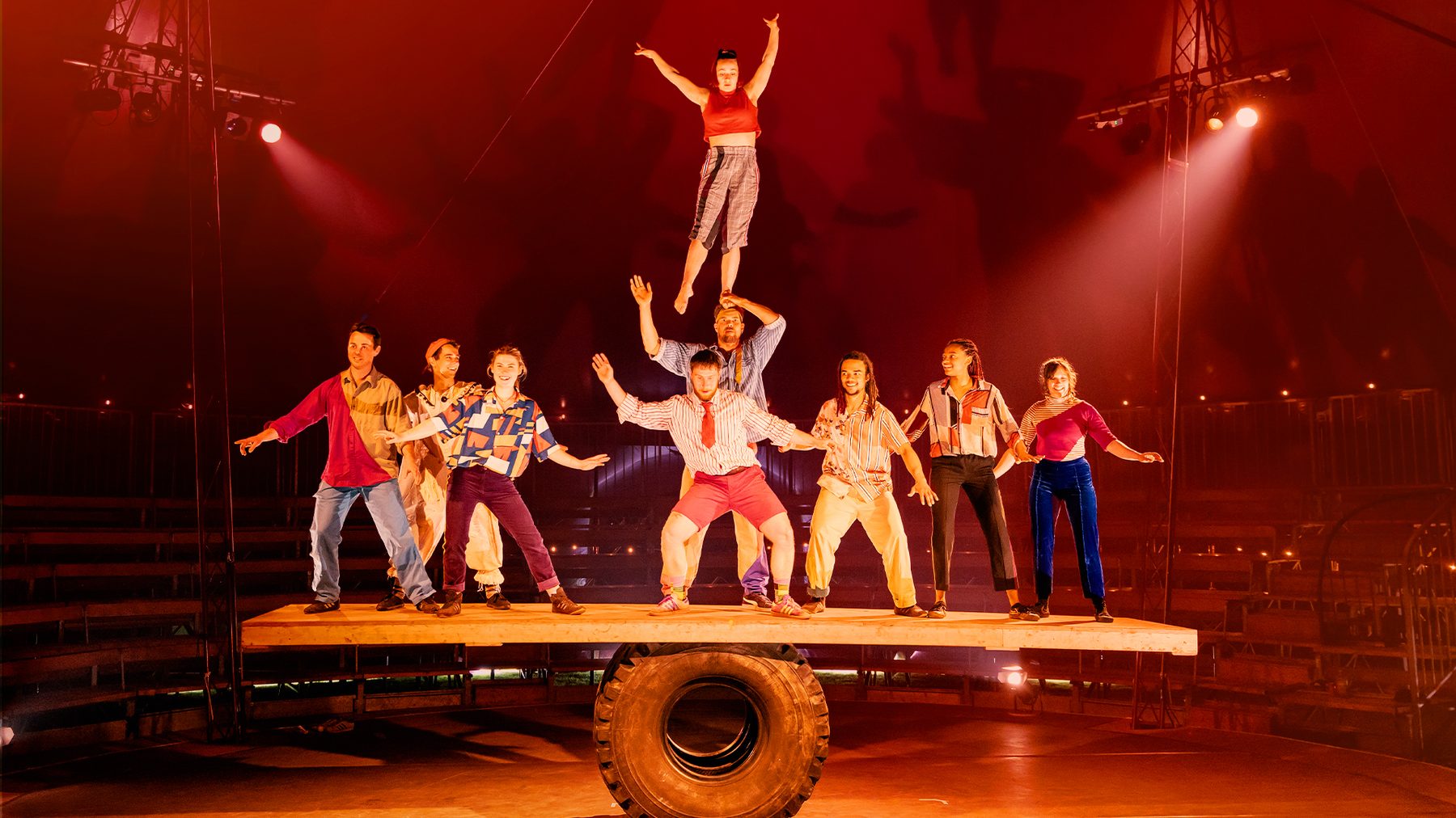 The Wing-Scuffle troupe balanced together on the Giant Rola Bola